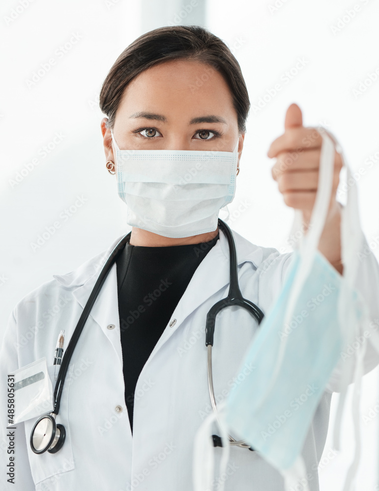 This is our advice to limit the spread of coronavirus. Cropped shot of a medical practitioner holding up a face mask. This is our advice to limit the spread of coronavirus. Cropped shot of a medical practitioner holding up a face mask.