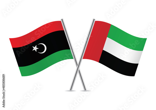 Libya and the United Arab Emirates crossed flags. Libyan and UAE flags isolated on white background. Vector illustration.