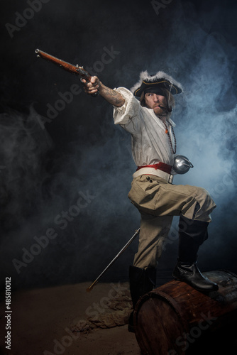 Φωτογραφία Portrait of pirate filibuster sea robber aiming from old pistol