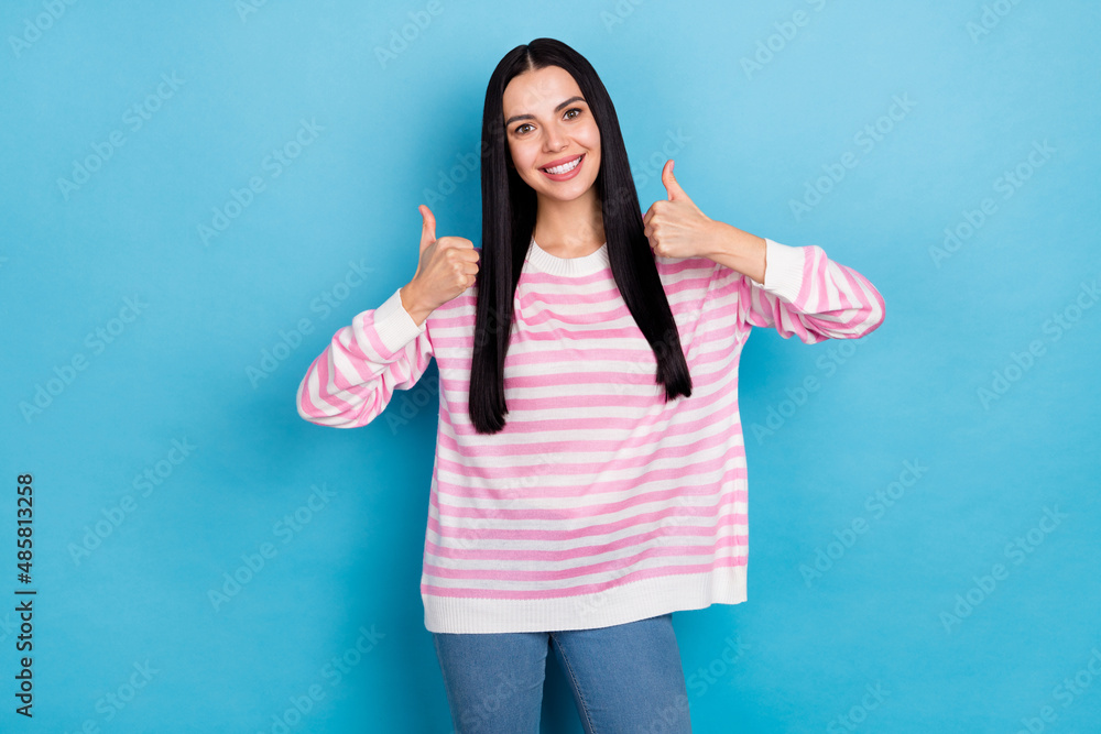 Photo of youth lovely lady show fingers thumbs-up ideal select quality isolated over blue color background Photo of youth lovely lady show fingers thumbs-up ideal select quality isolated over blue color background