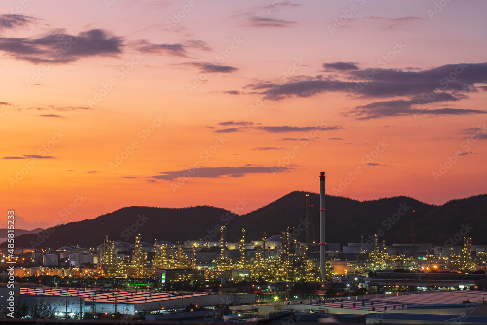 Oil​ refinery​ and​ plant of petrochemistry industry in oil​ and​ gas​ ​industry with​ cloud​ ​sky the sunset