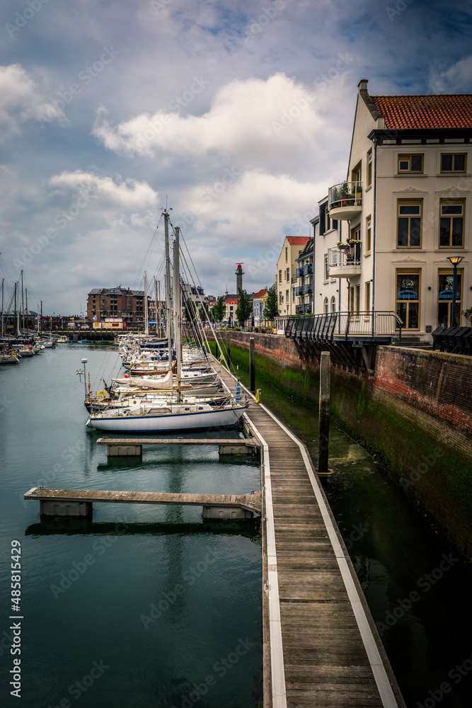 Fototapeta premium Sailing ships lie still along a pier in the port of Vlissingen in the Netherlands