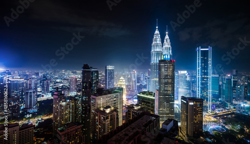 Panorama aerial night view of Kuala Lumpur city skyline. Malaysia. Blue mode