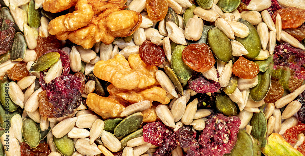 Nuts, seeds and dried fruits as a background. Flat lay. Top view