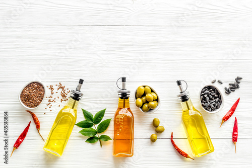 Different kind of cooking oil - sunflower olive and sesame oil with seeds photo
