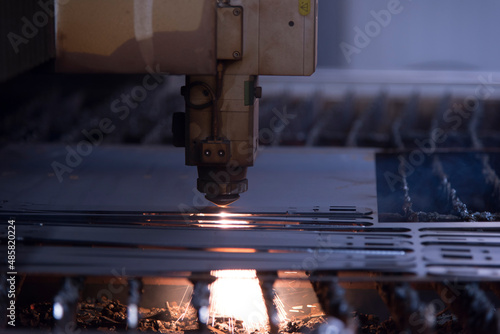 Laser machine cutting of metal sheet with sparks