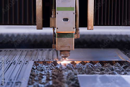 Laser machine cutting of metal sheet with sparks