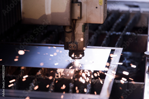 Laser machine cutting of metal sheet with sparks