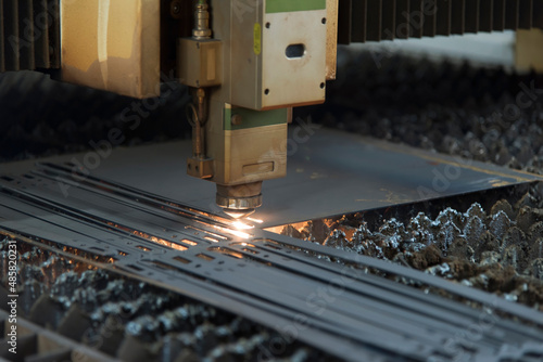 Laser machine cutting of metal sheet with sparks