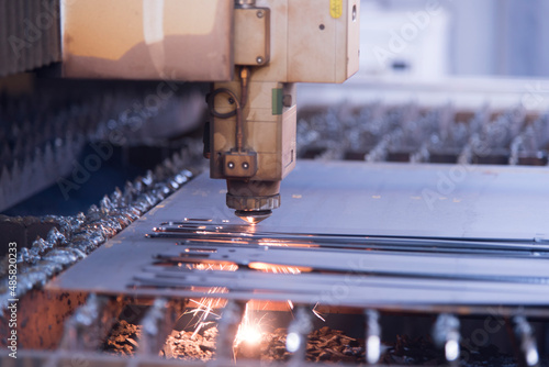 Laser machine cutting of metal sheet with sparks