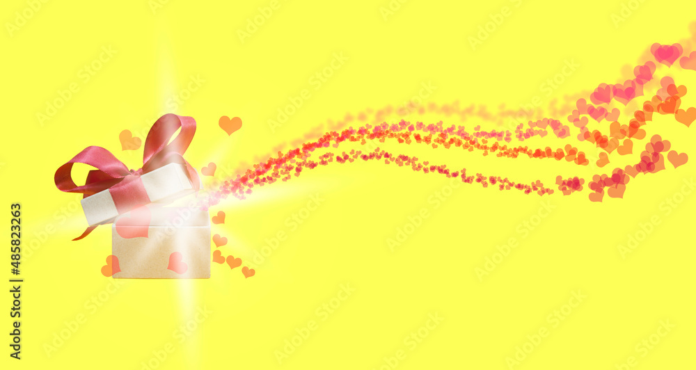 red hearts on a yellow background fly out from under the open lid of a gift box with a red bow red hearts on a yellow background fly out from under the open lid of a gift box with a red bow
