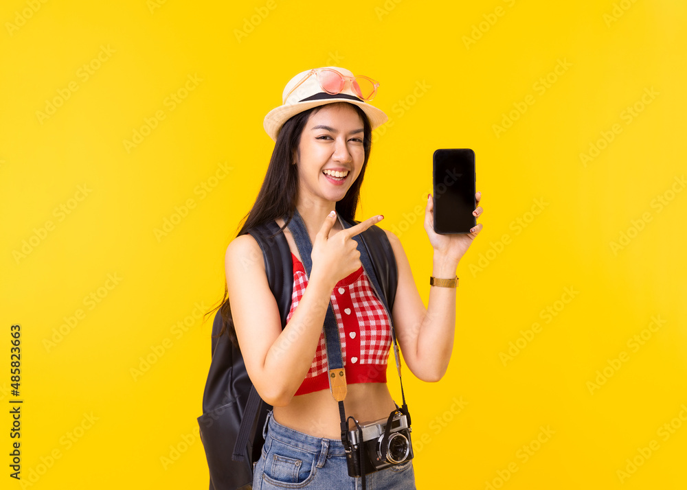 Tourist woman in summer casual clothes.Asian Smiling woman .Passenger traveling abroad to travel on yellow colour background.Asian woman going to summer vacation.Travel trip funny. Tourist woman in summer casual clothes.Asian Smiling woman .Passenger traveling abroad to travel on yellow colour background.Asian woman going to summer vacation.Travel trip funny.