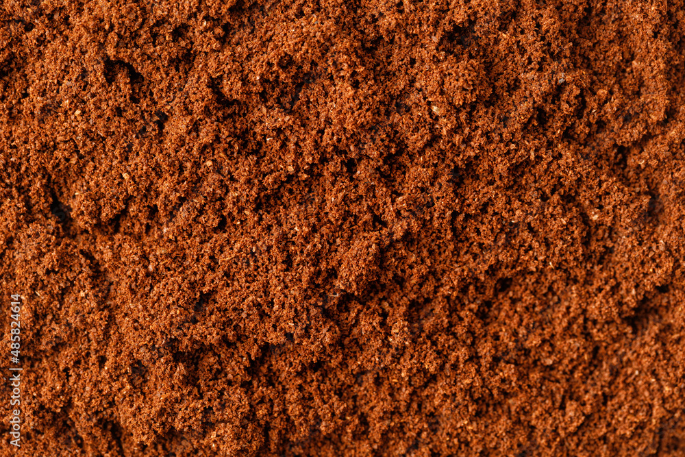 Ground coffee. Texture background with coffee, close up, top view Ground coffee. Texture background with coffee, close up, top view