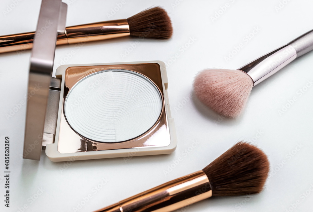 Minimal style,face powder with a brush on white background, flat lay, top view. Minimal style,face powder with a brush on white background, flat lay, top view.