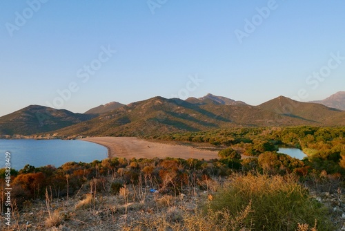 Sandy beach of Galeria with Fango delta in the midst of rocky coastline between Galeria and Calvi. Corsica, France.