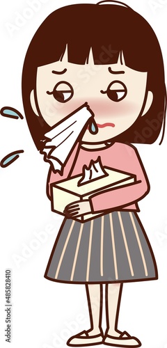 ティッシュ箱を持ち、鼻をかむ若い女性。