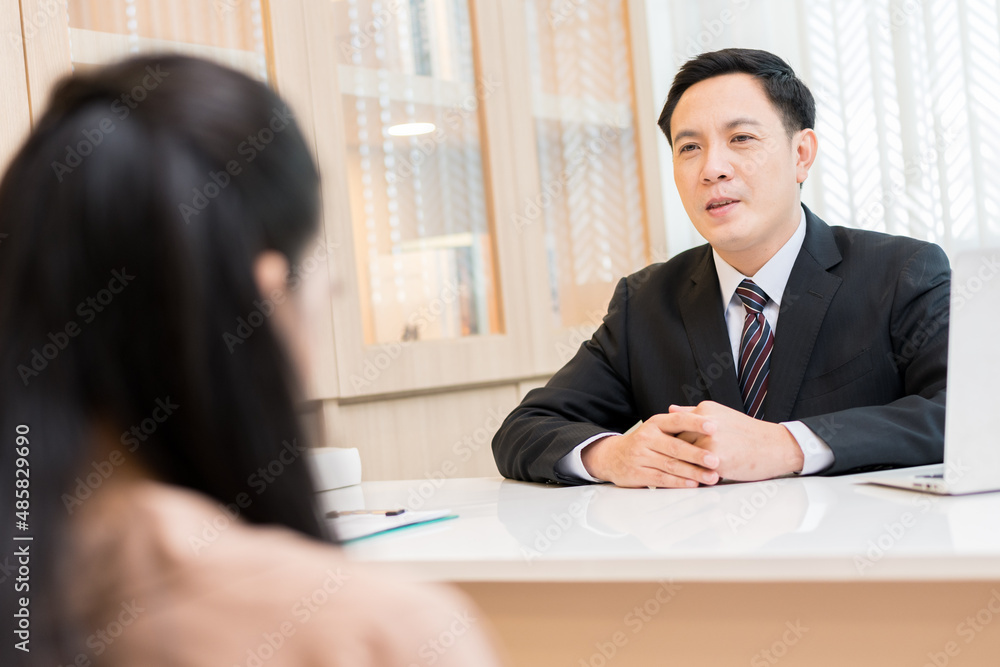 Asian business man wearing suit, tie, handsome hard working in private office meeting with staff concept finance marketing company president Asian business man wearing suit, tie, handsome hard working in private office meeting with staff concept finance marketing company president