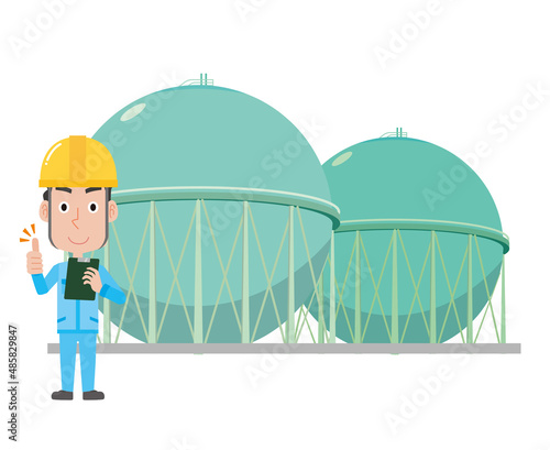 都市ガスのガスタンクと作業員男性