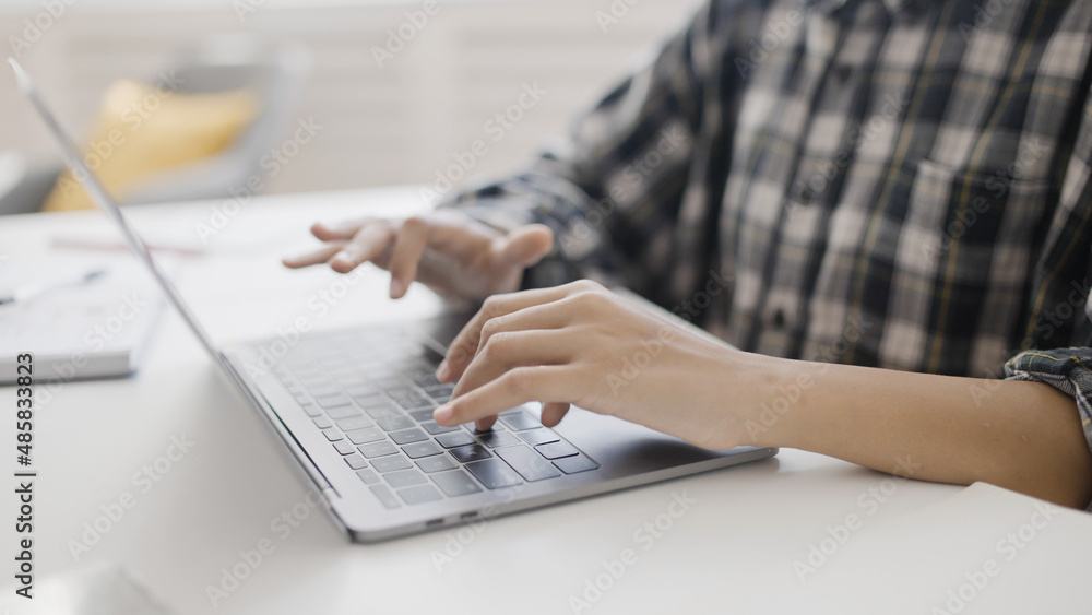 Girl typing on laptop at home, online programming course, digital learning Girl typing on laptop at home, online programming course, digital learning