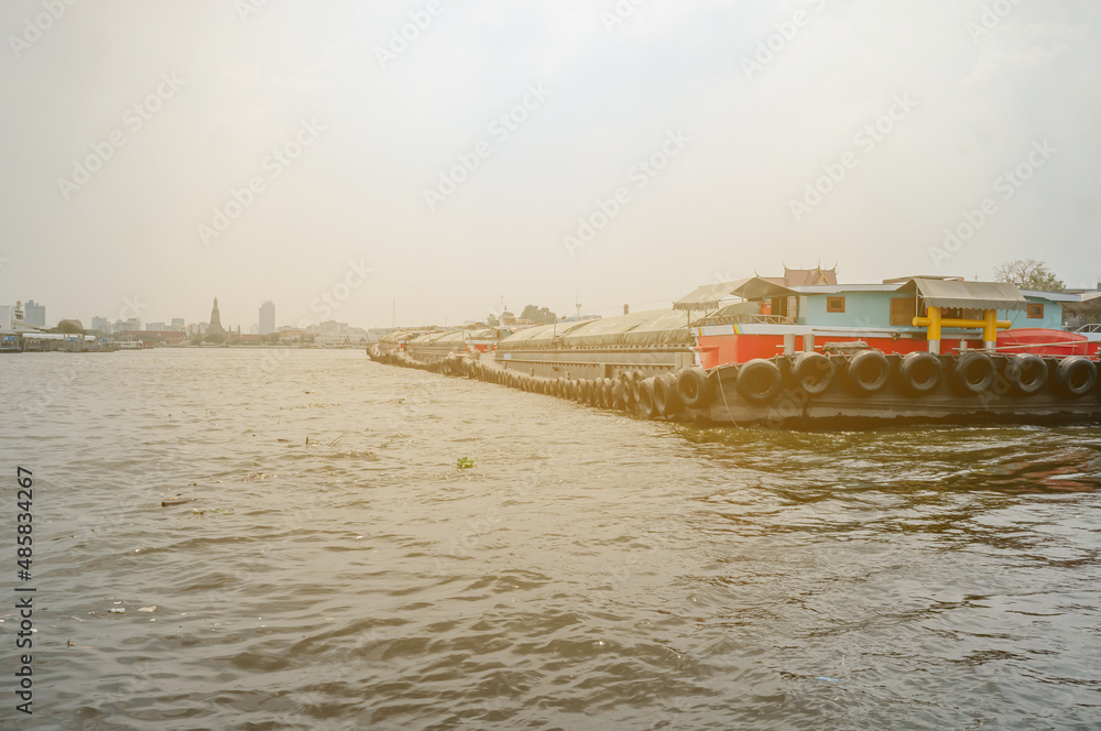 Sand barges along Chao Phraya river, Bangkok, Thailand