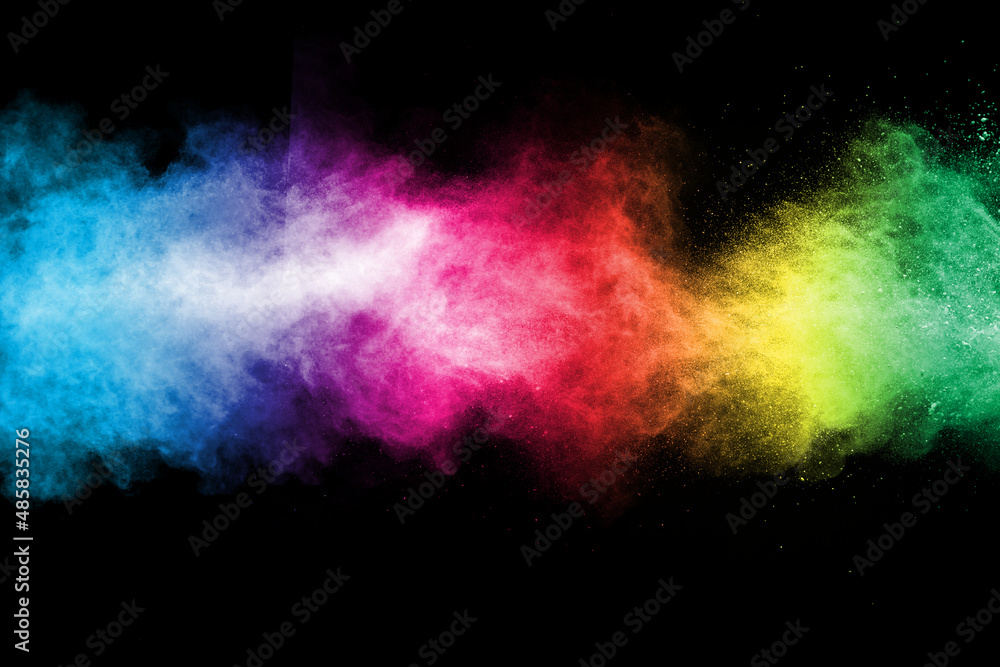 Explosion of colored powder on black background.