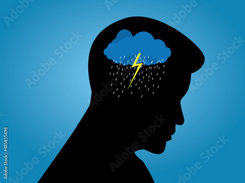 Depression mental health concept. Silhouette of a man with rain cloud in his head