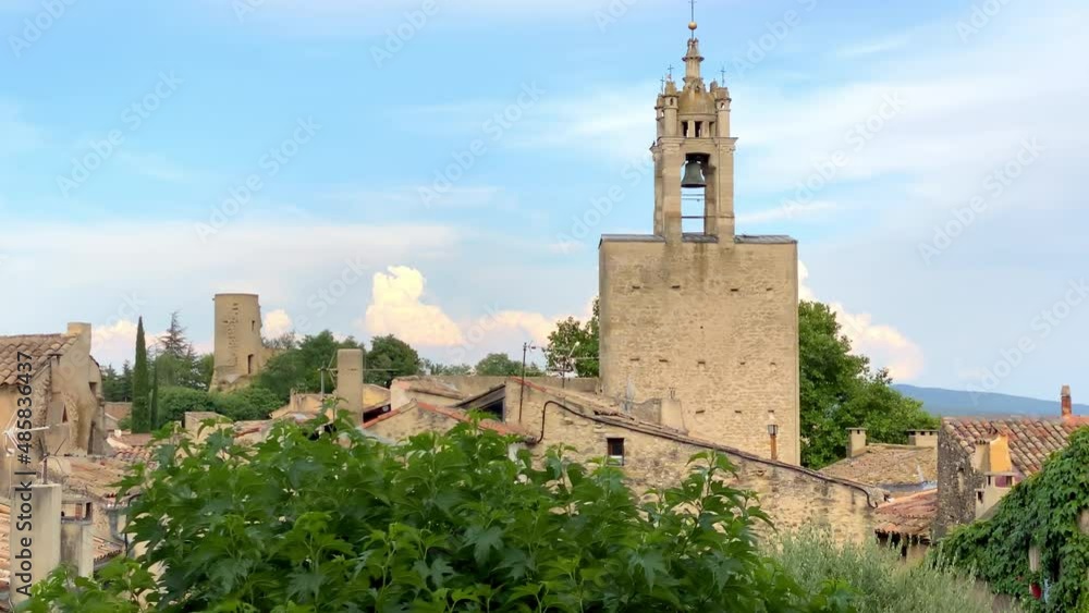 Clock tower of the village of Cucuron in the Luberon valley in Provence, France Clock tower of the village of Cucuron in the Luberon valley in Provence, France