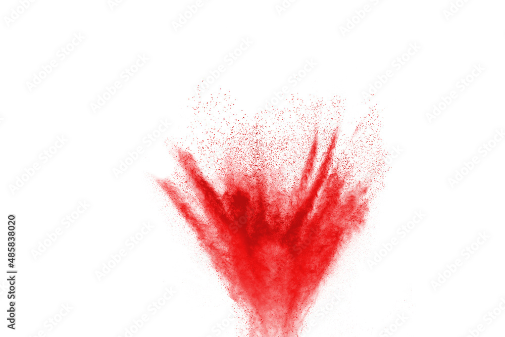Freeze motion of red color powder exploding on white background.