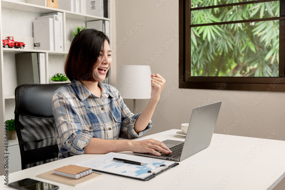 Work from home. Young business was glad that the job was done well. Work from home. Young business was glad that the job was done well.