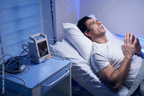 Male in white t-shirt resting after procedures