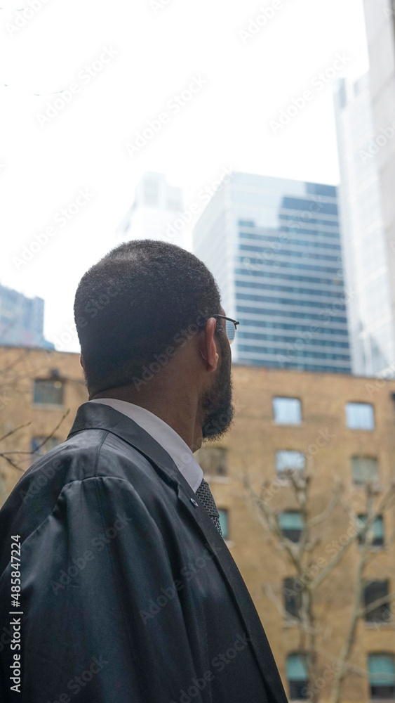 UK, London, Business man looking at skyscrapers UK, London, Business man looking at skyscrapers
