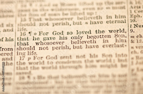 Close-up of John 3:16 (KJV), text with a shallow depth of field highlighting key words photo