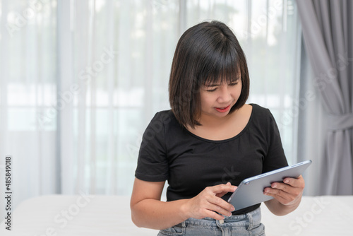 Asian women working on laptop at room. Concept of work form home. portrait women smile use technology mobile. Concept business. Free Download Asian women working on laptop at room. Concept of work form home. portrait women smile use technology mobile. Concept business. - GFXLoad