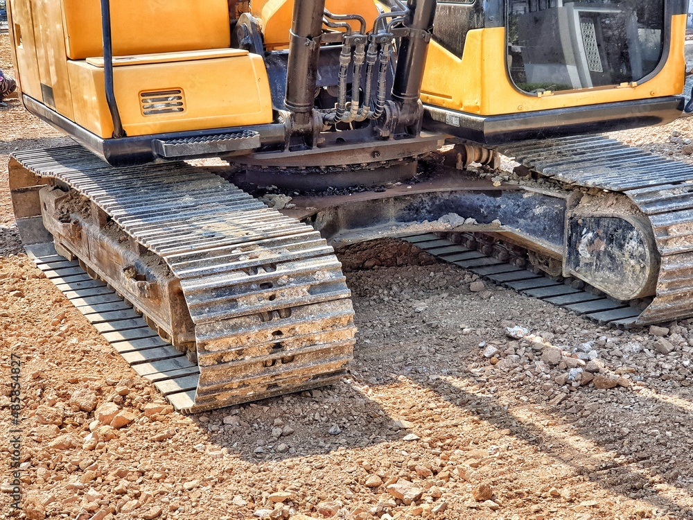 Fototapeta premium backhoe to excavate the soil on the ground.construction site excavator.wheel&nbsp;loader