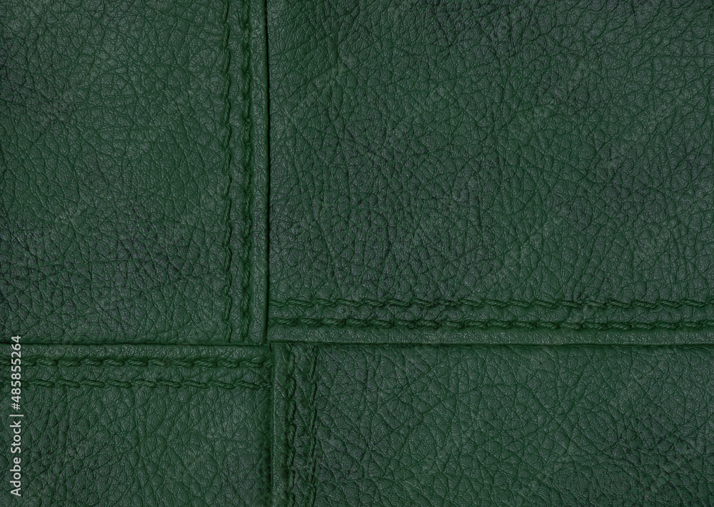 Fototapeta premium Green texture leather background. Stitch leather