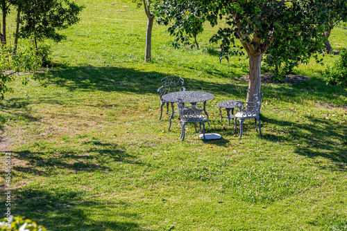 Garden with table and chairs. Travel photograph, wonderful sunny spring day, Alcaucin, Malaga, Andalusia, Spain