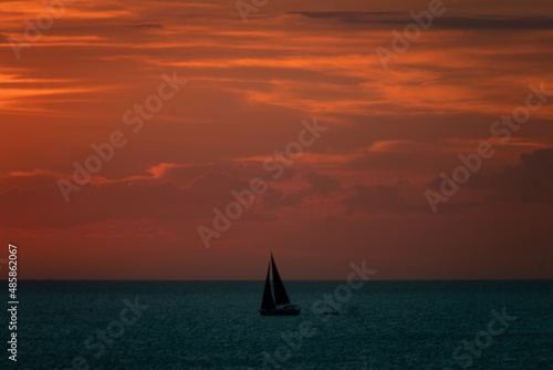 Sailboat at Sunset Skies over the sea