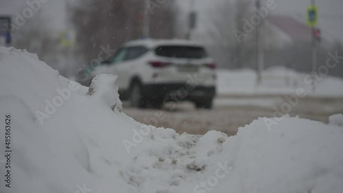 Wallpaper Mural City roads during heavy snowfalls. Cars drive through winter mud and snow Torontodigital.ca