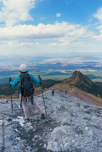 Woman hiking in mountains in mexico photo