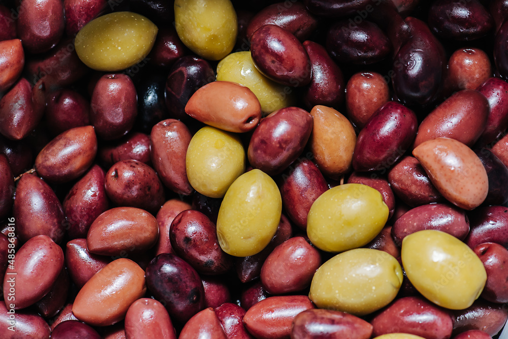 Texture of intact olives red and green. Single mass all over the image. Texture of intact olives red and green. Single mass all over the image.
