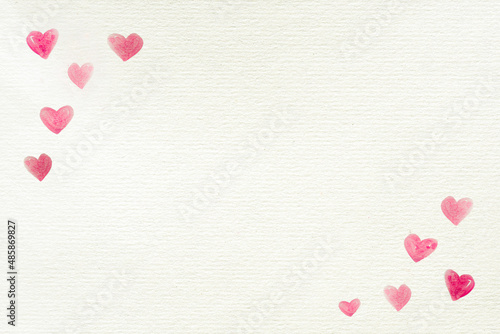 Love background with hearts painted in the corners on a recycled white paper for Valentine's Day or other celebrations, letter, copy space