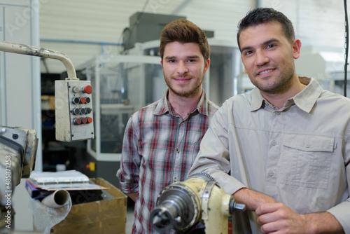Tableau sur toile a portrait of machinists looking at camera