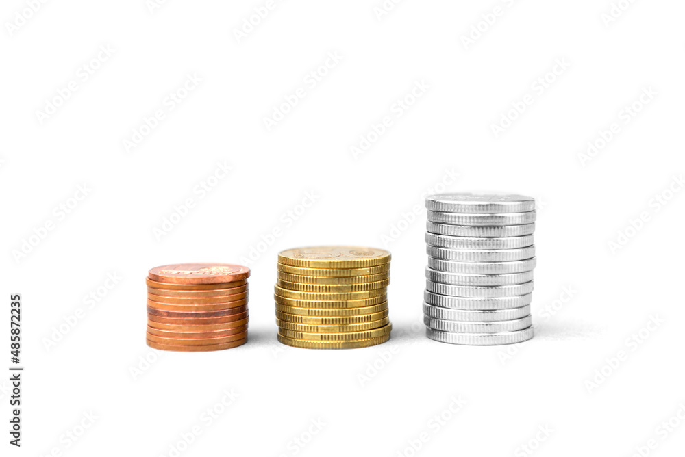 Coins stacked on a white background. Money saving concept. Coins stacked on a white background. Money saving concept.