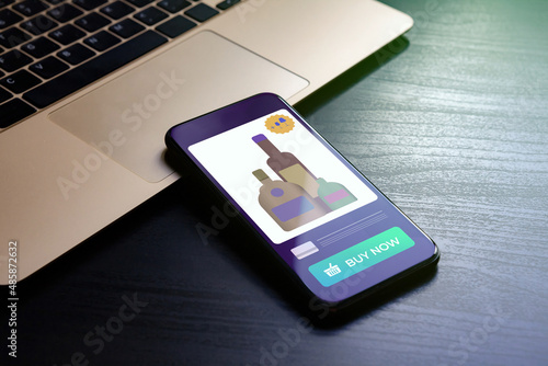 Alcohol Delivery Service concept. E-commerce remote ordering of wine, cognac, vodka, whiskey, rum by mobile phone in alco shop store