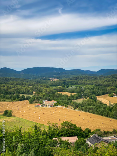 Panoramic landscape view of the surroundings of Grambois and the agricultural fields of the Luberon valley in Vaucluse, France