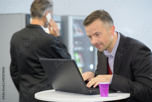 businessman working while having a coffee break photo