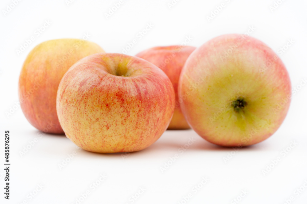 red ripening apples isolated on a white background, close up red ripening apples isolated on a white background, close up