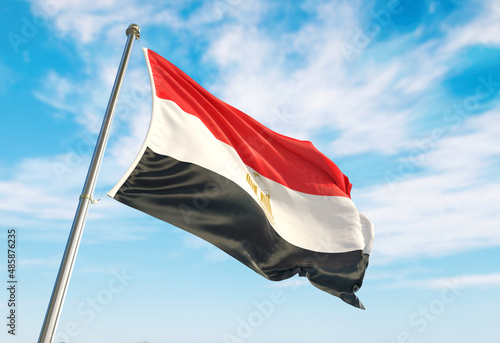 3d rendering Egypt flag waving in the wind on flagpole. Perspective wiev Egypt flag waving a blue cloudy sky photo
