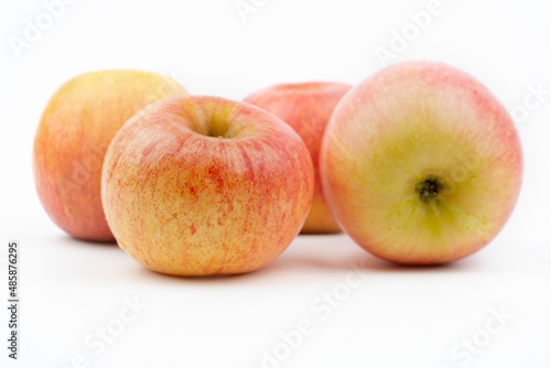 red ripening apples isolated on a white background, close up