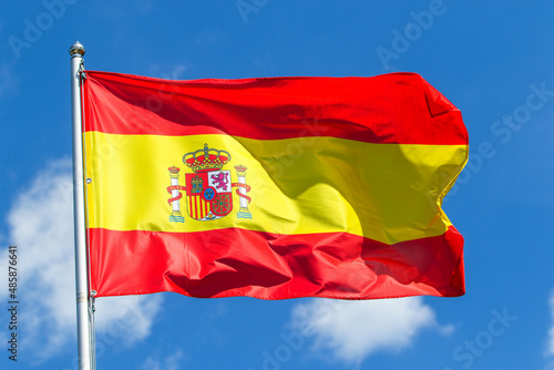 Spain national flag on blue sky background